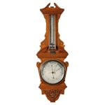 An Edwardian Oak Cased Aneroid Barometer