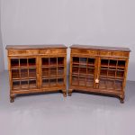 Pair of Georgian-style figured walnut neat-sized glazed bookcases.