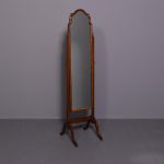 Neat- sized Queen Anne-style mahogany cheval mirror.