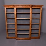 Mid Victorian tall, figured golden elm breakfront, 3-section open bookcase