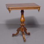 Mid-Victorian octagonal shaped, figured walnut occasional table on a stylish tripod base.